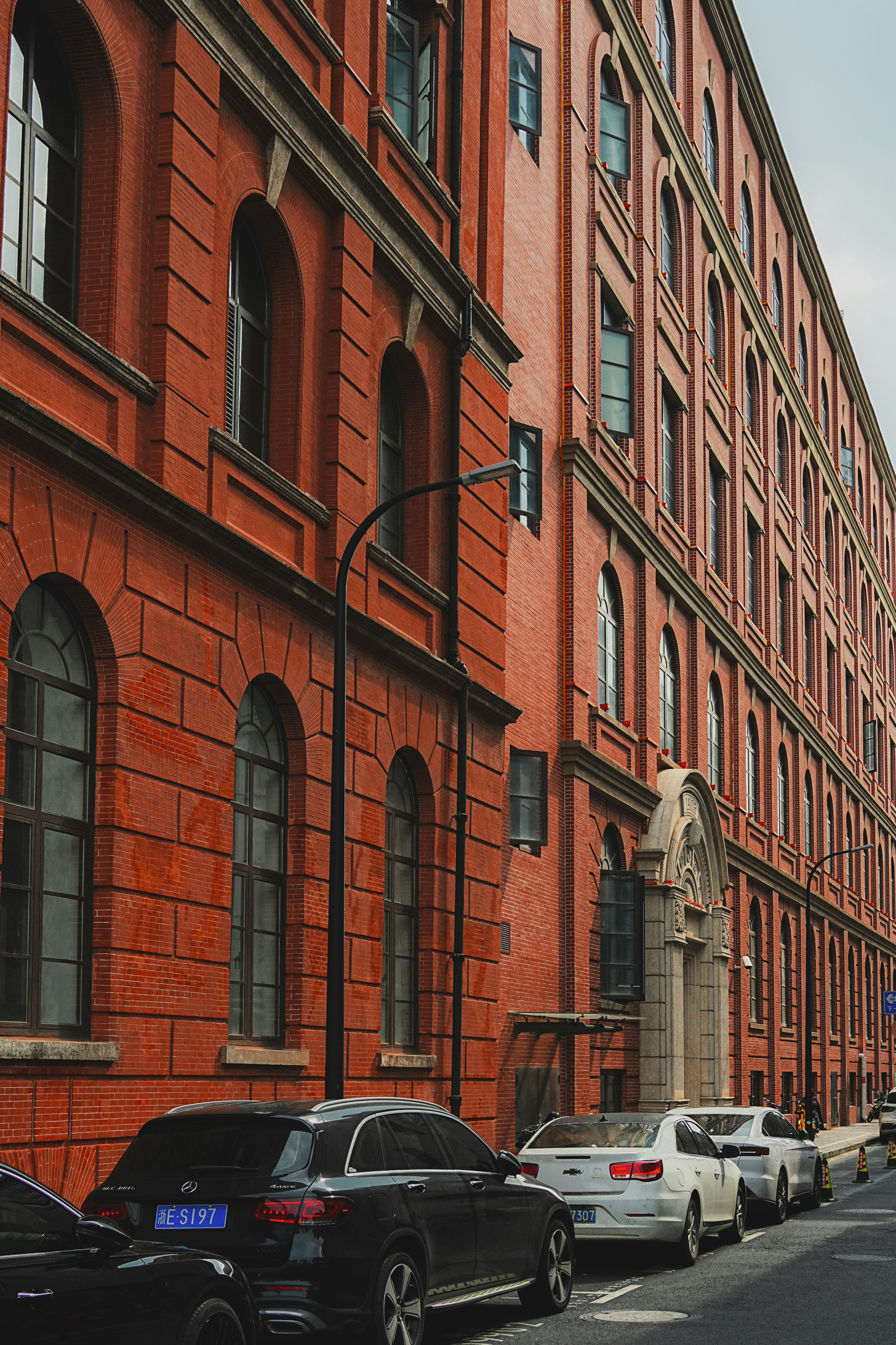 Red-brick architectural texture on a back street near the Bund